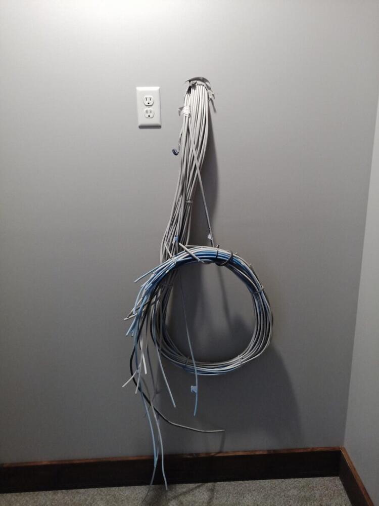 Bundled network cables staged for termination in new home structured wiring project